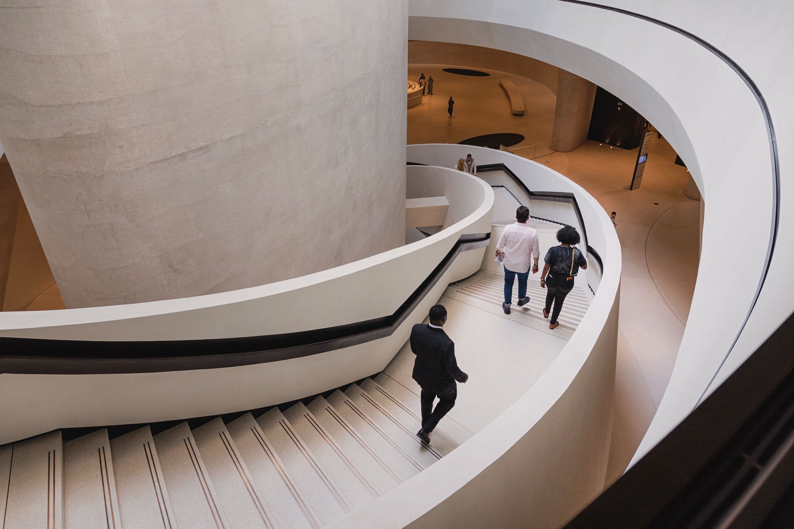 Curved staircase and flowing interior design at Zayed National Museum